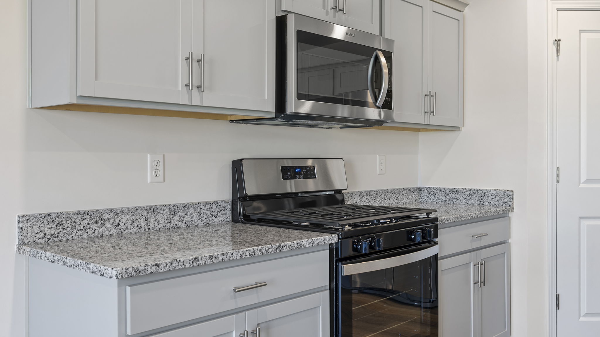 Kitchen has stainless steel appliances.