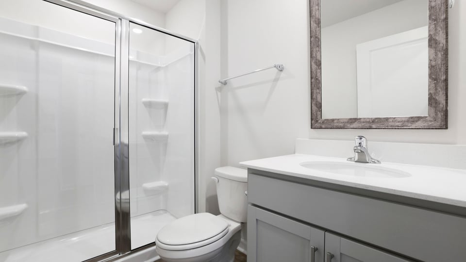 Bathroom with single vanity sink and shower.