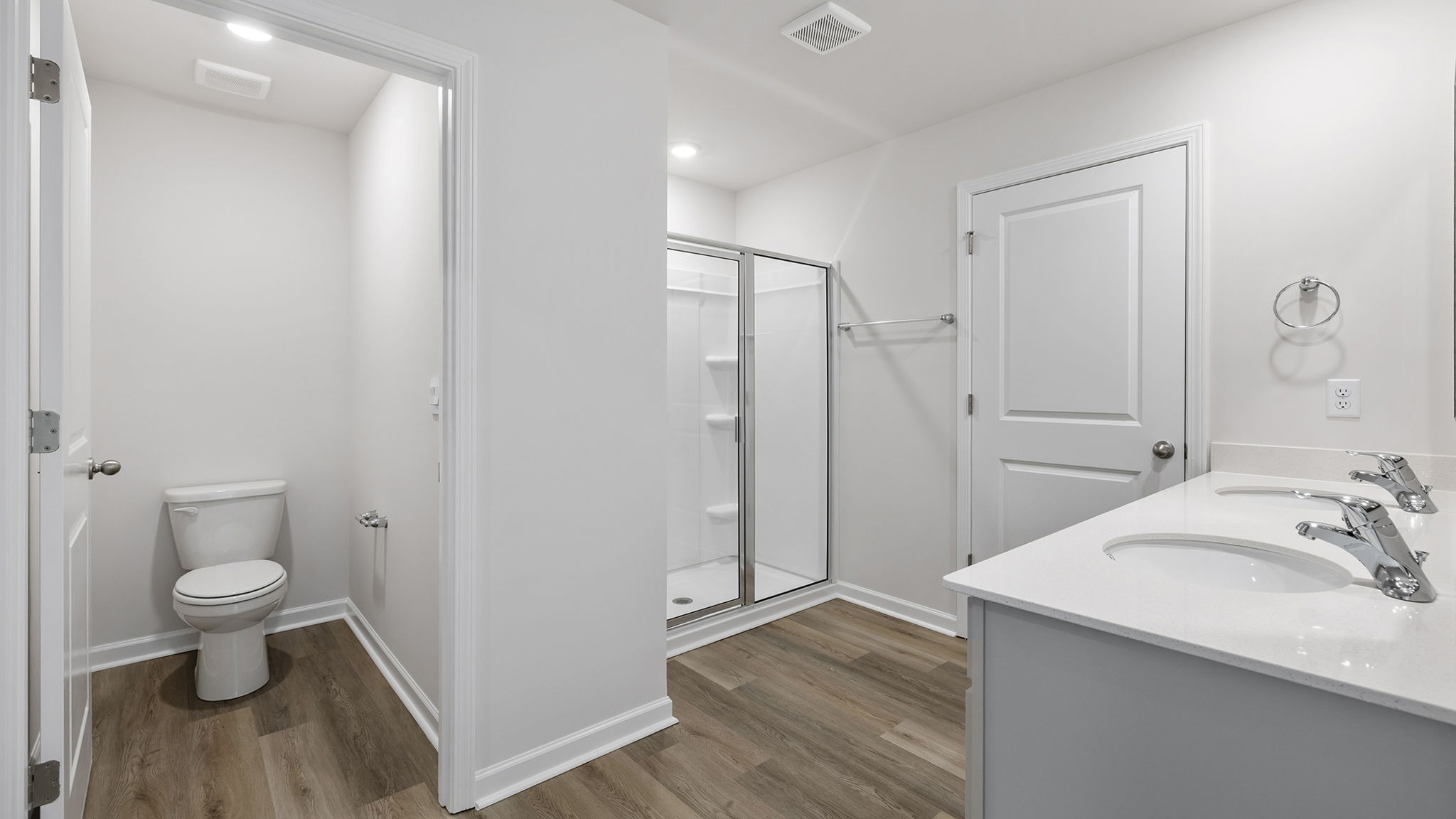 Primary bathroom with dual sink vanity.