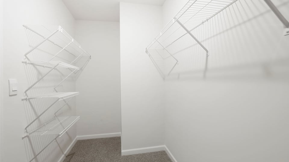 Closet with hanging storage racks.