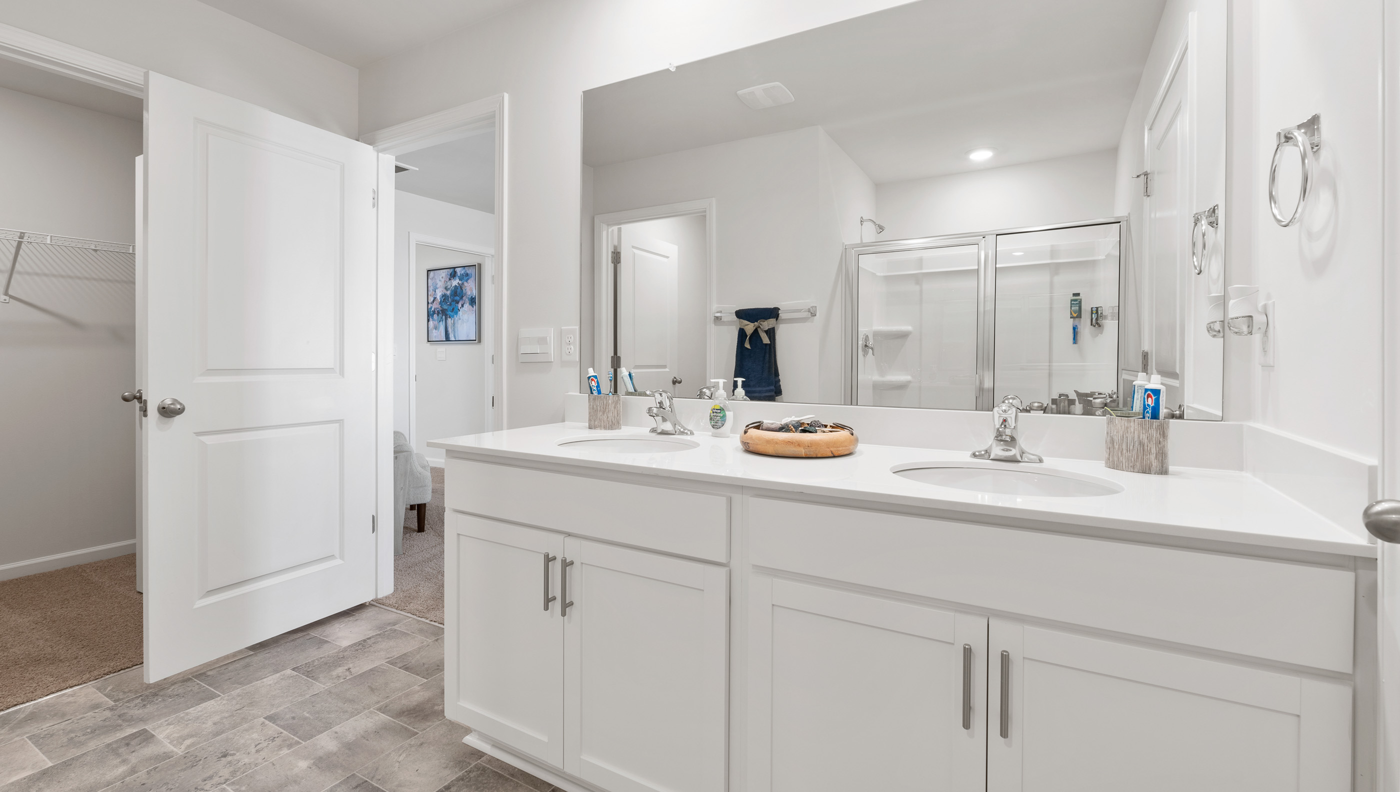Primary bathroom with double vanity sinks.