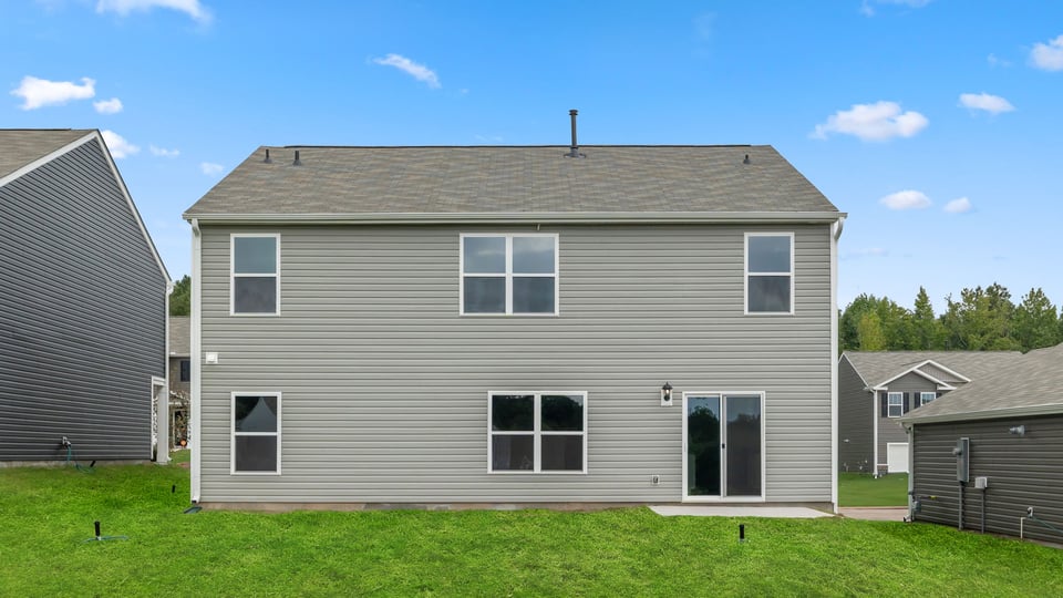 Back exterior with large backyard.