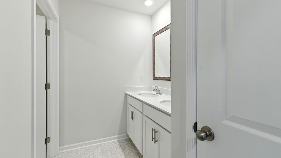 Bathroom with double vanity sinks.