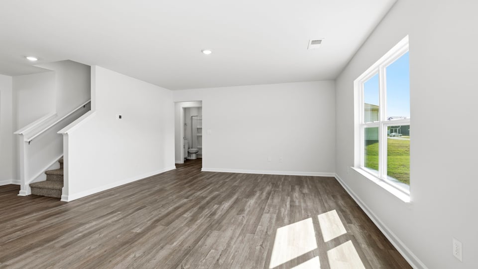 Family room with windows and fireplace.