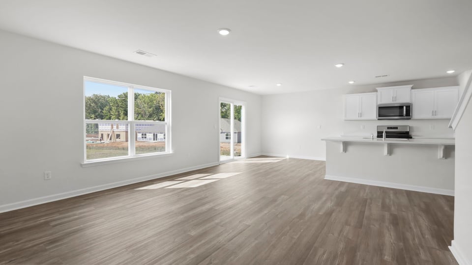 Family room with windows and fireplace.