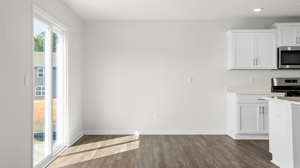 Family room with windows and fireplace.