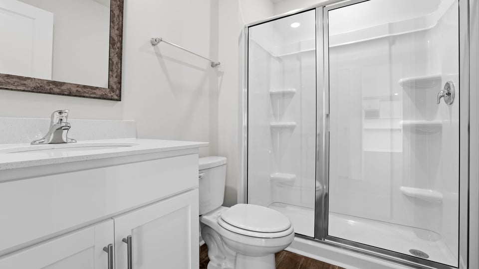 Bathroom with sink and walk in shower.