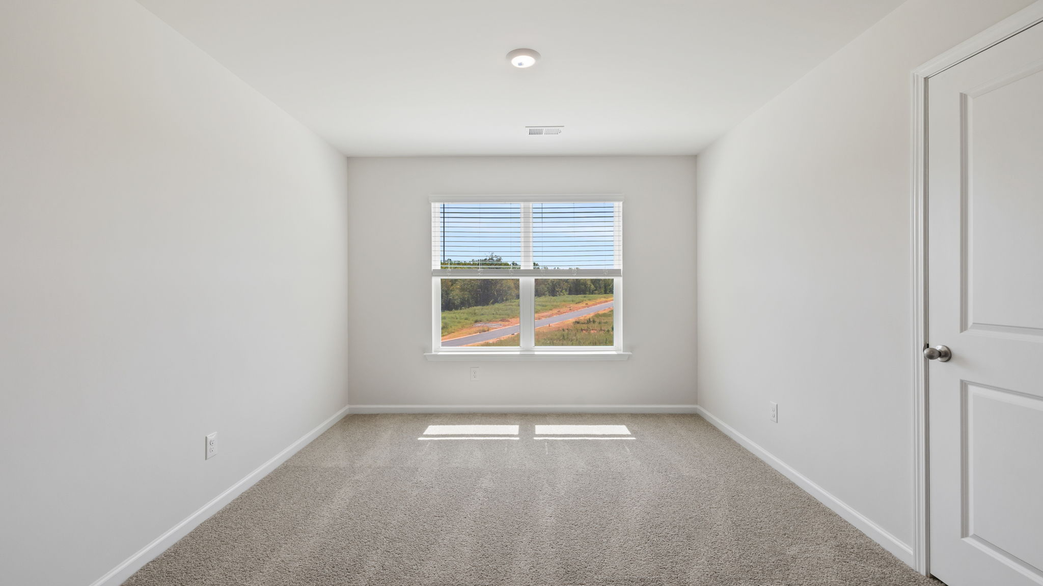 Loft area with large window.