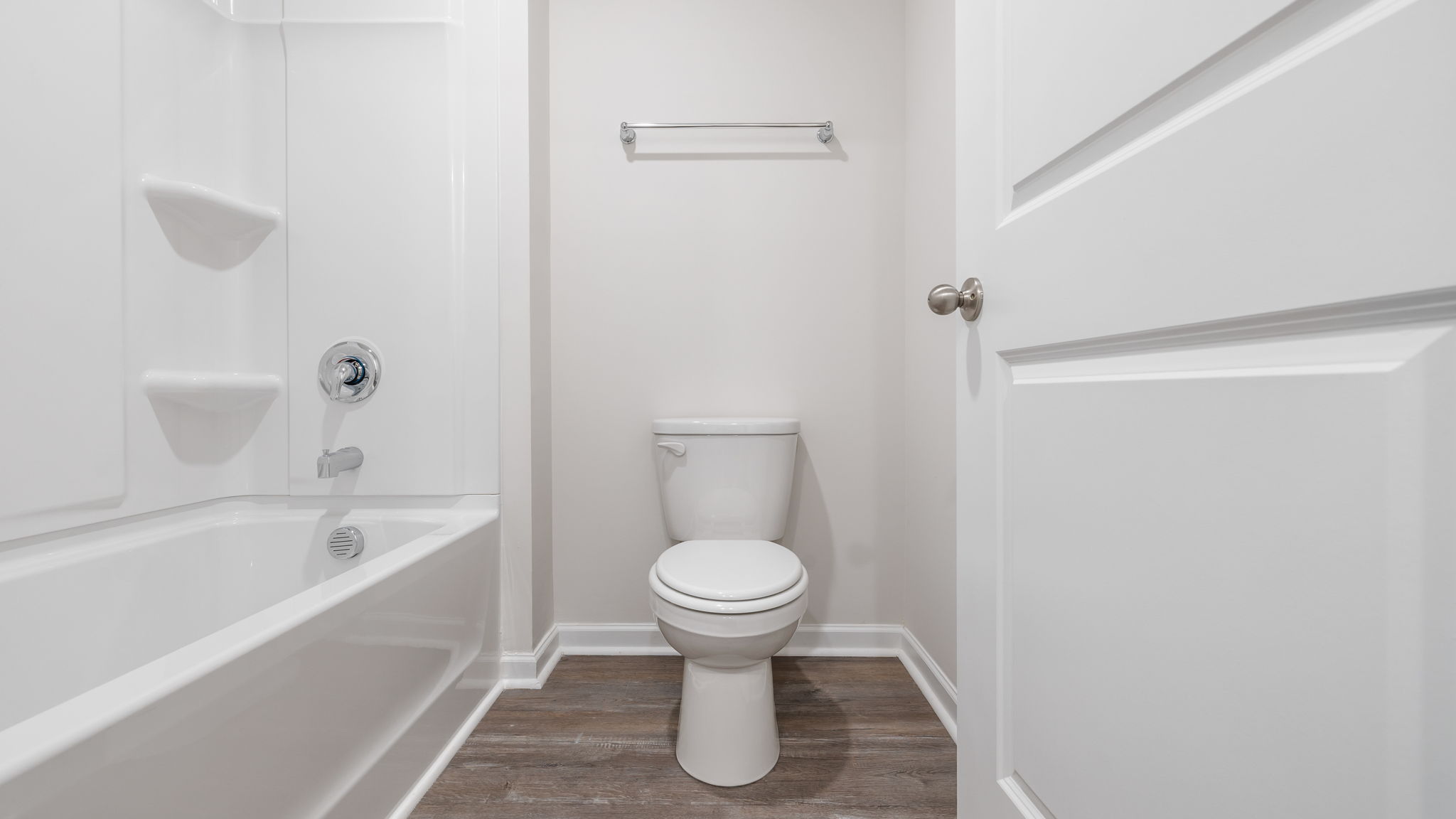 Hall bathroom toilet and shower area.