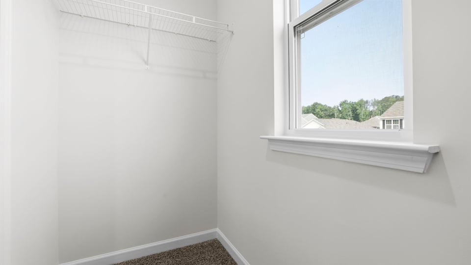 Closet with hanging storage racks.