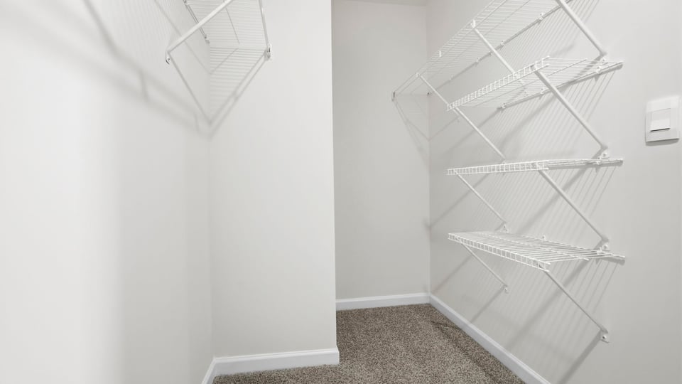 Closet with hanging storage racks.