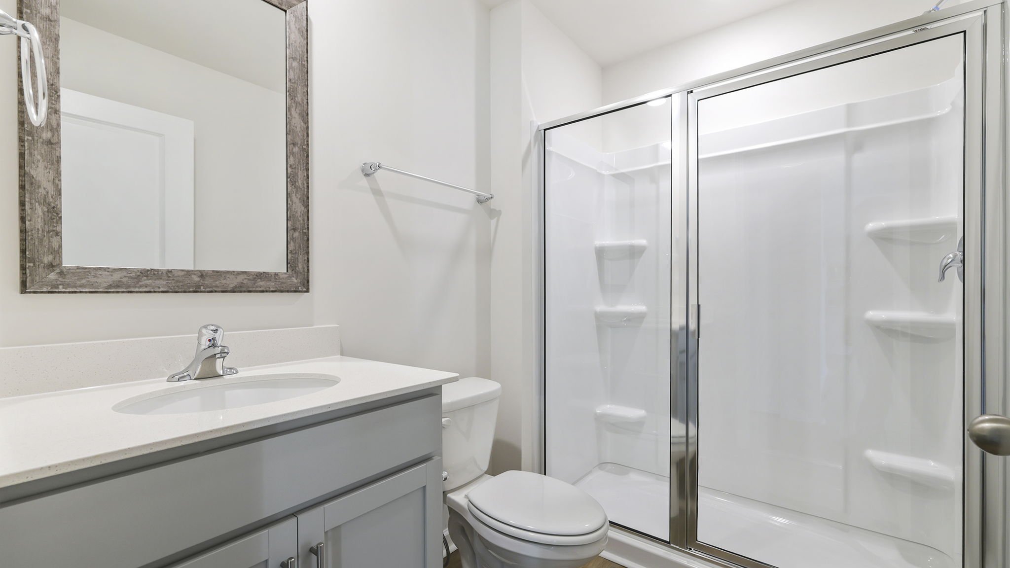 Full bath on the main level with vanity and combination shower / tub.