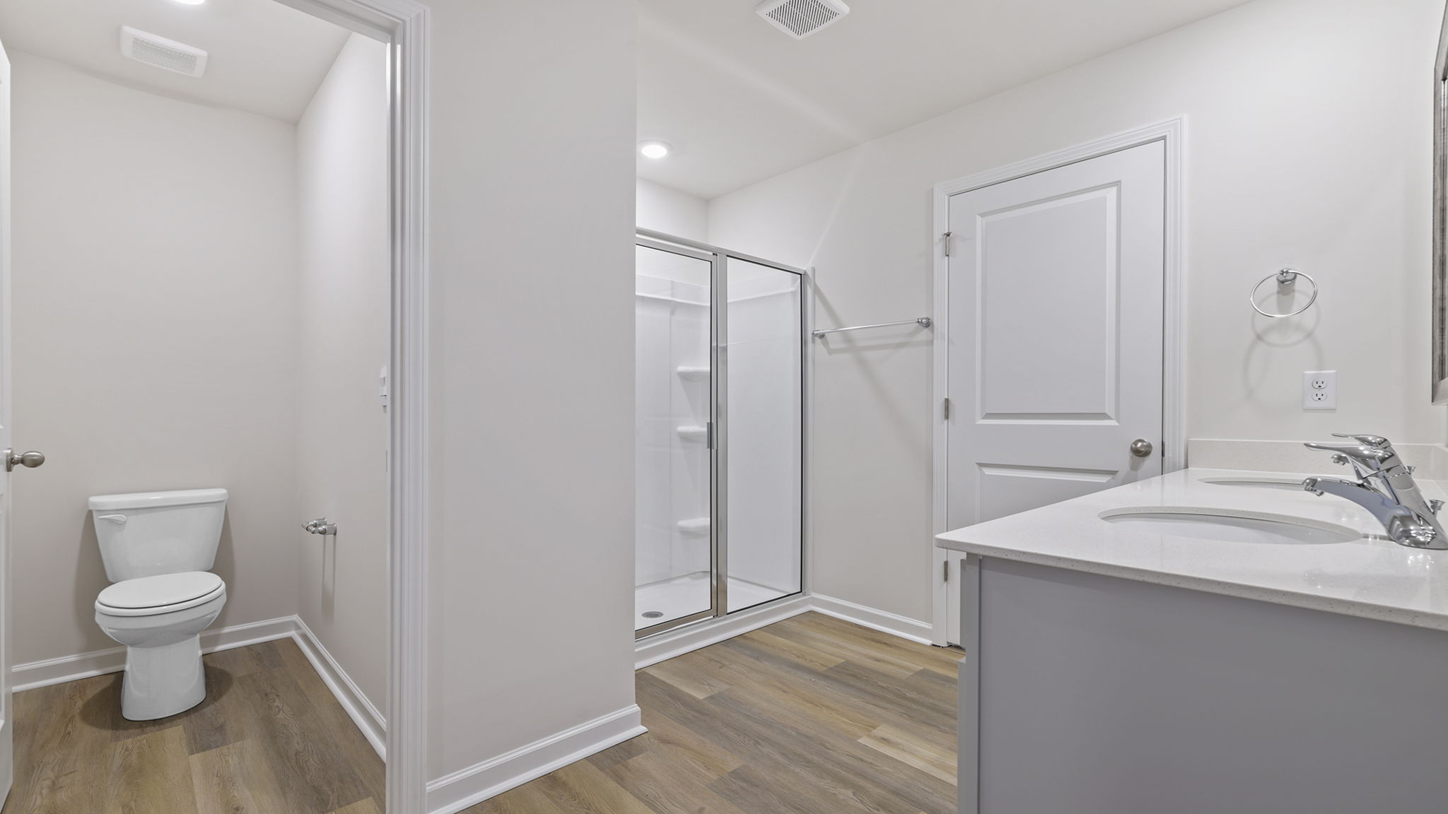Primary bathroom with dual sink vanity.