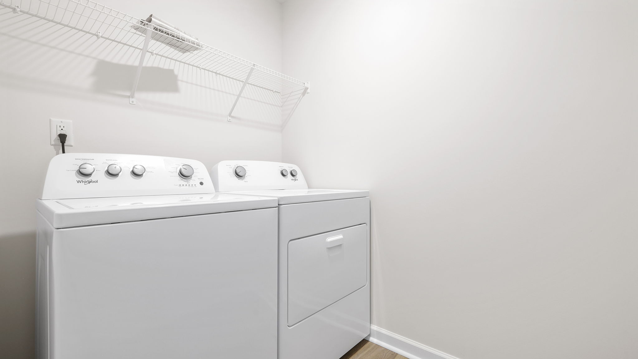 Laundry room with shelving.