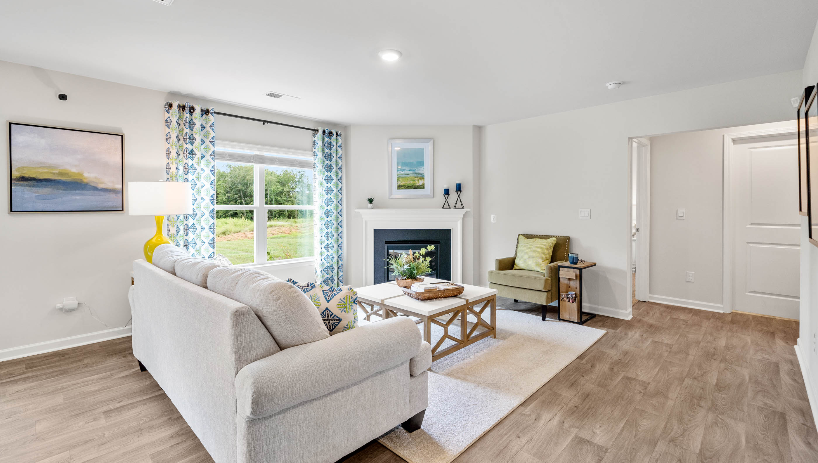 Family room with windows and fireplace.