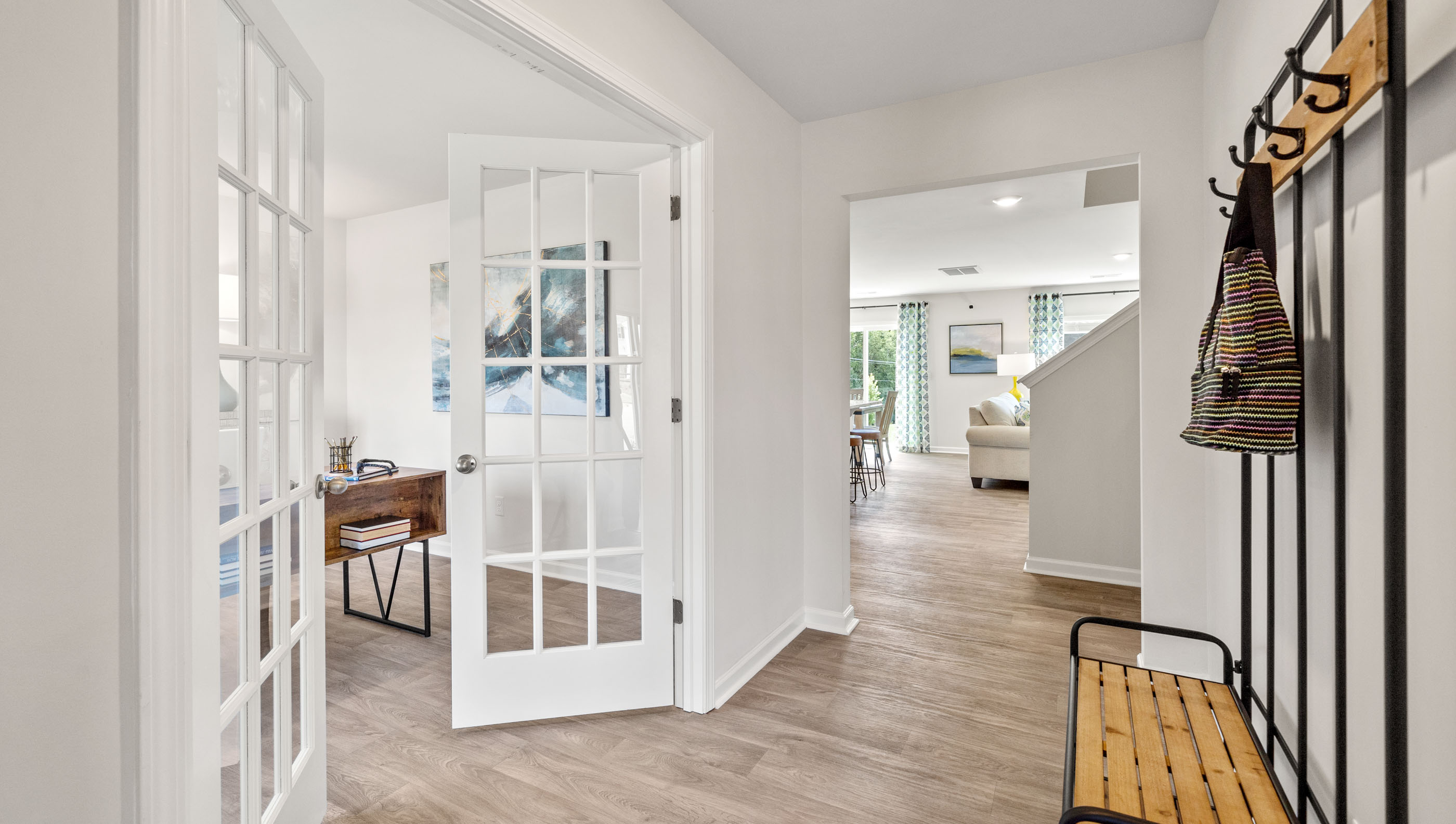 Hallway into home with view of office.