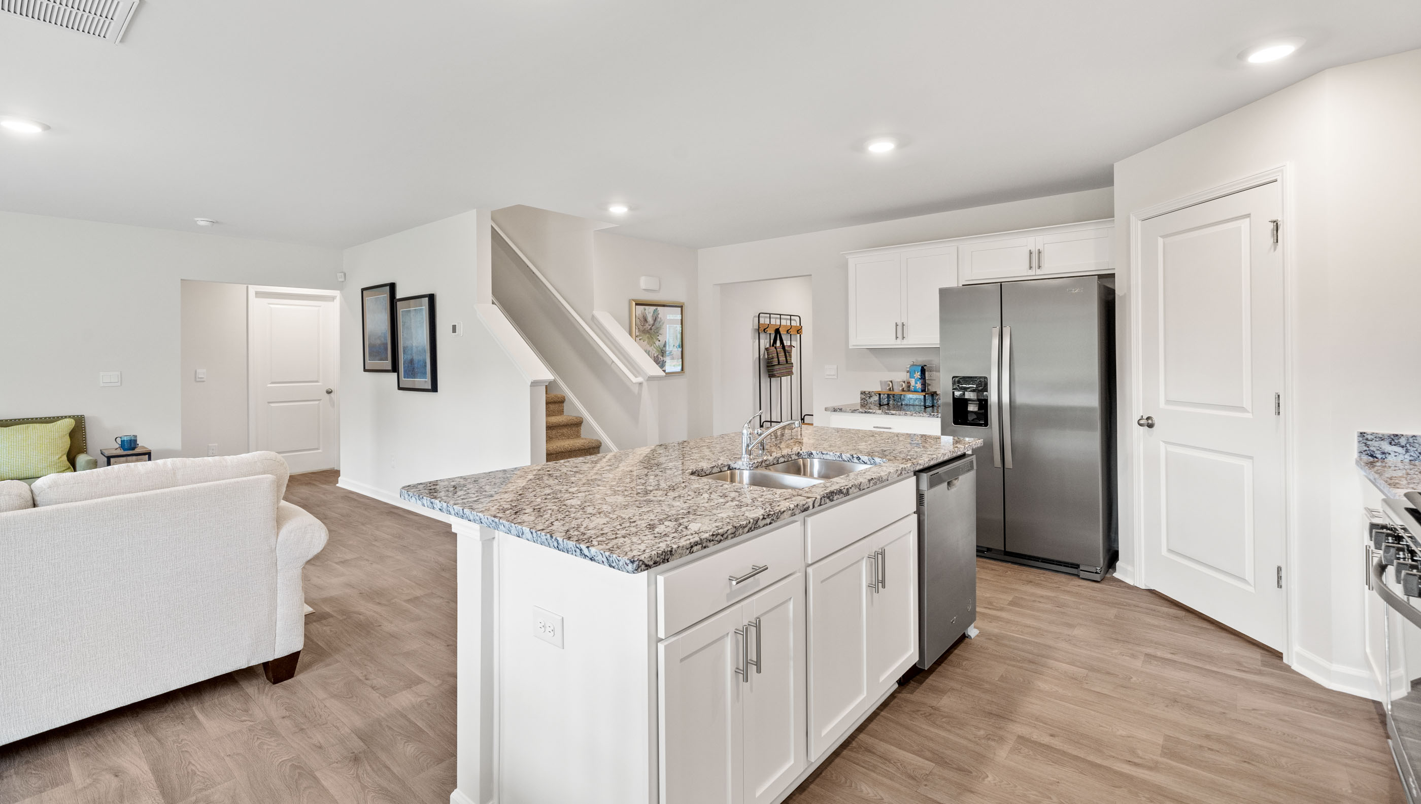 Kitchen and island with granite counter tops.