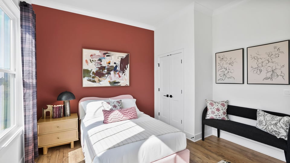 Bedroom with large window.