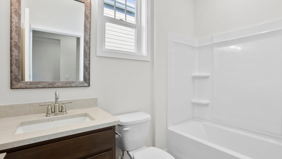 Bathroom with vanity and tub.