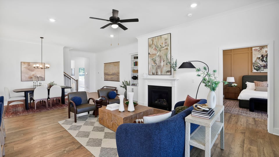 Family room with large windows and fireplace.