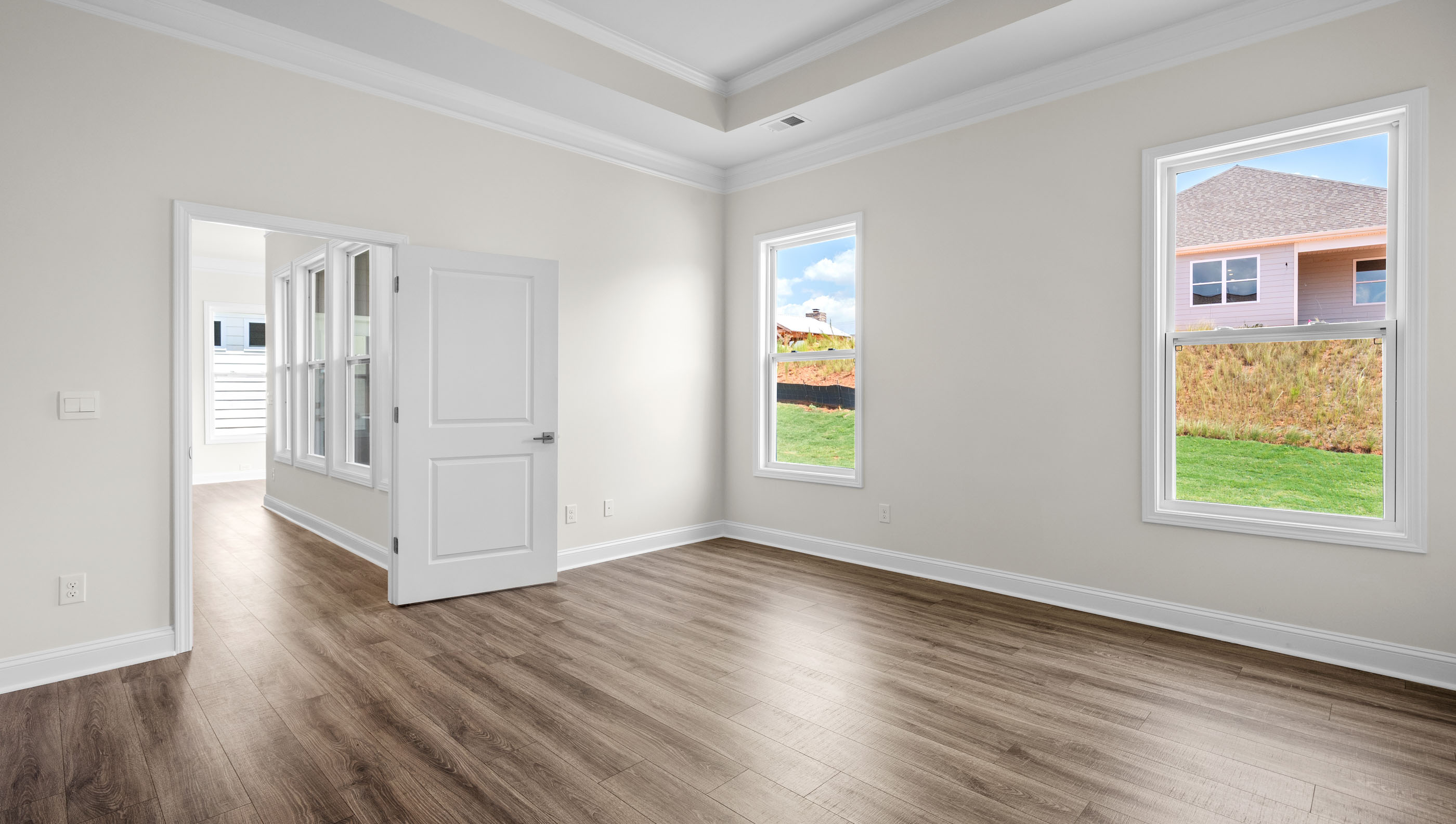 Primary bedroom with windows.a