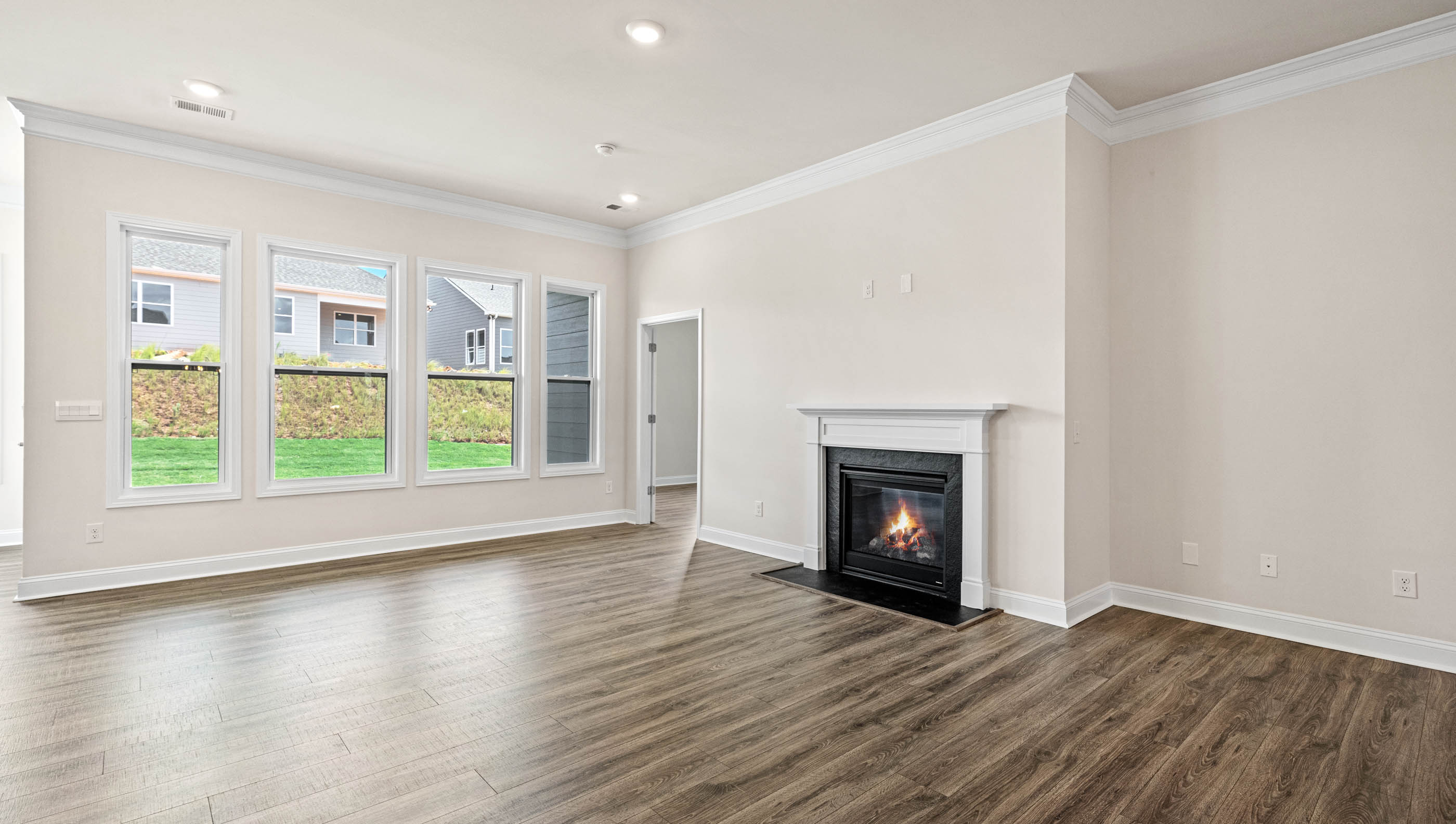 Livingroom with fireplace and windows.