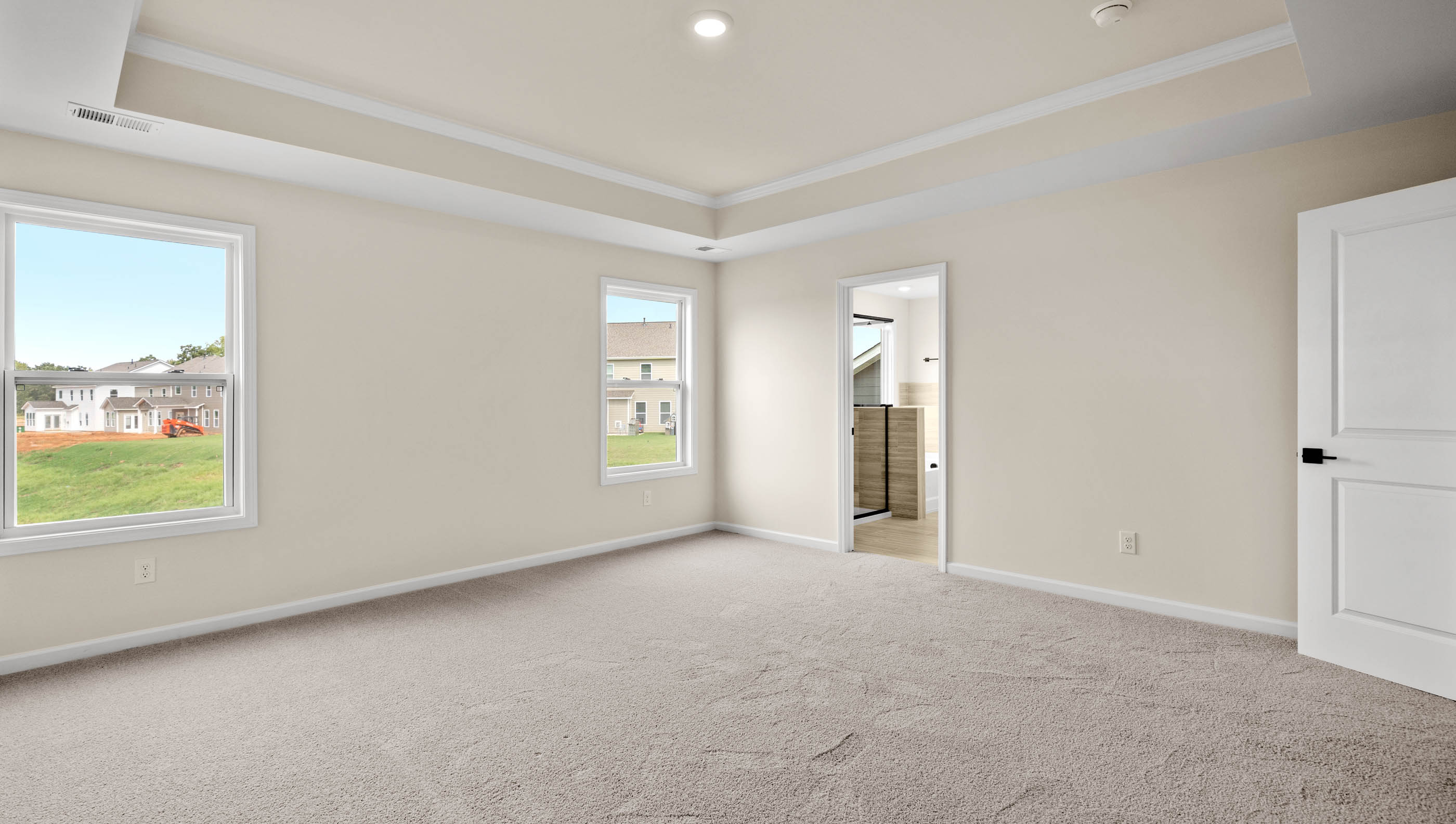 Bedroom with carpet and window.