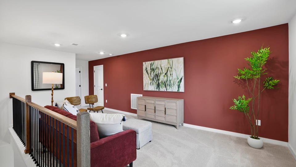 Bonus room with carpet and windows.
