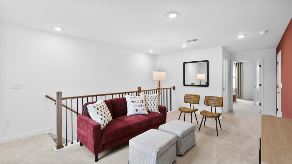 Bonus room with carpet and windows.