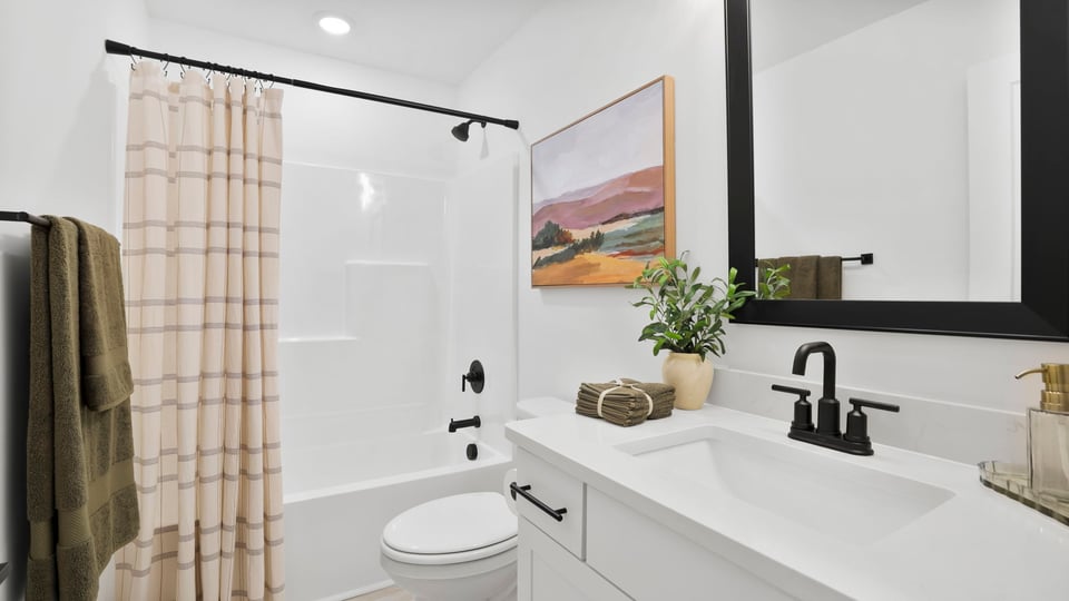 Bathroom with sink and shower.