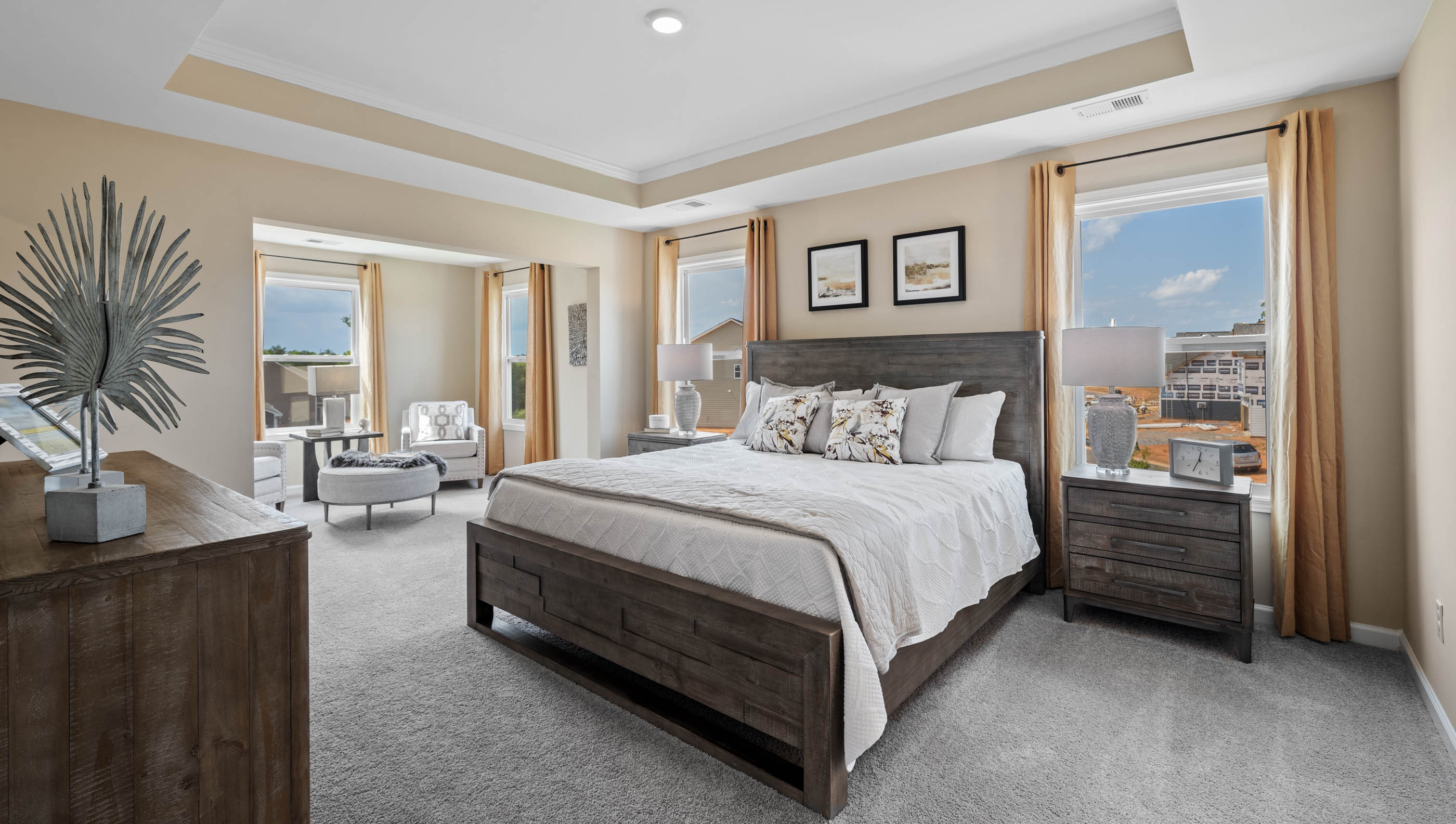 Bedroom with carpet and windows.