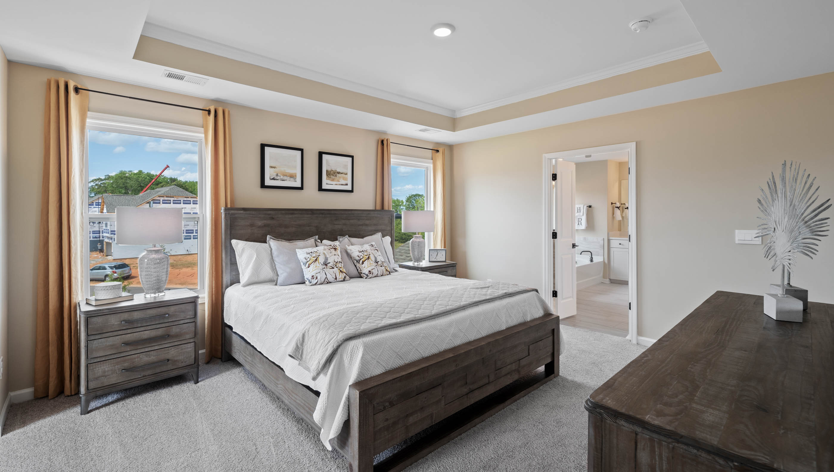 Bedroom with carpet and windows.