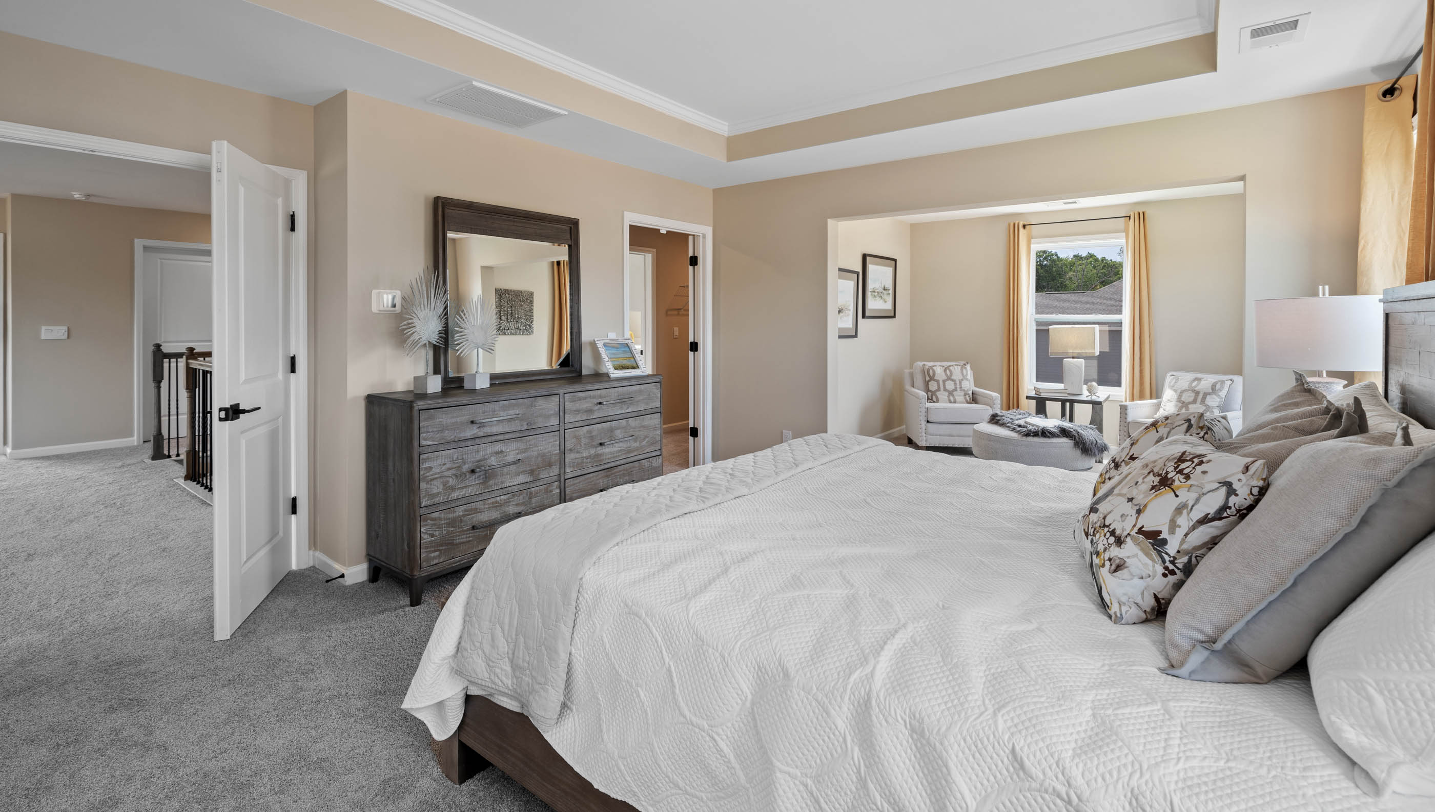 Bedroom with carpet and windows.