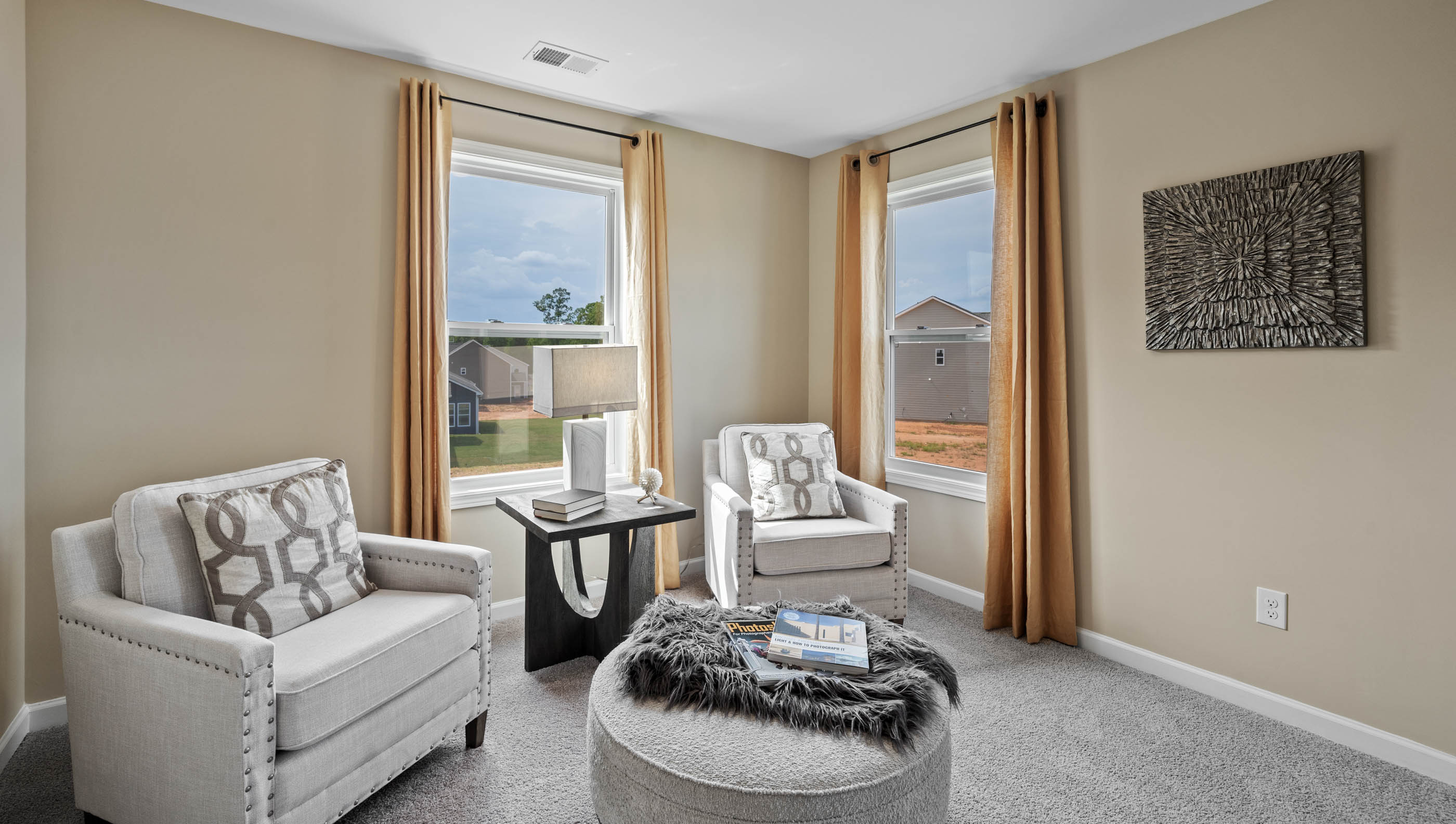 Bedroom with carpet and windows.