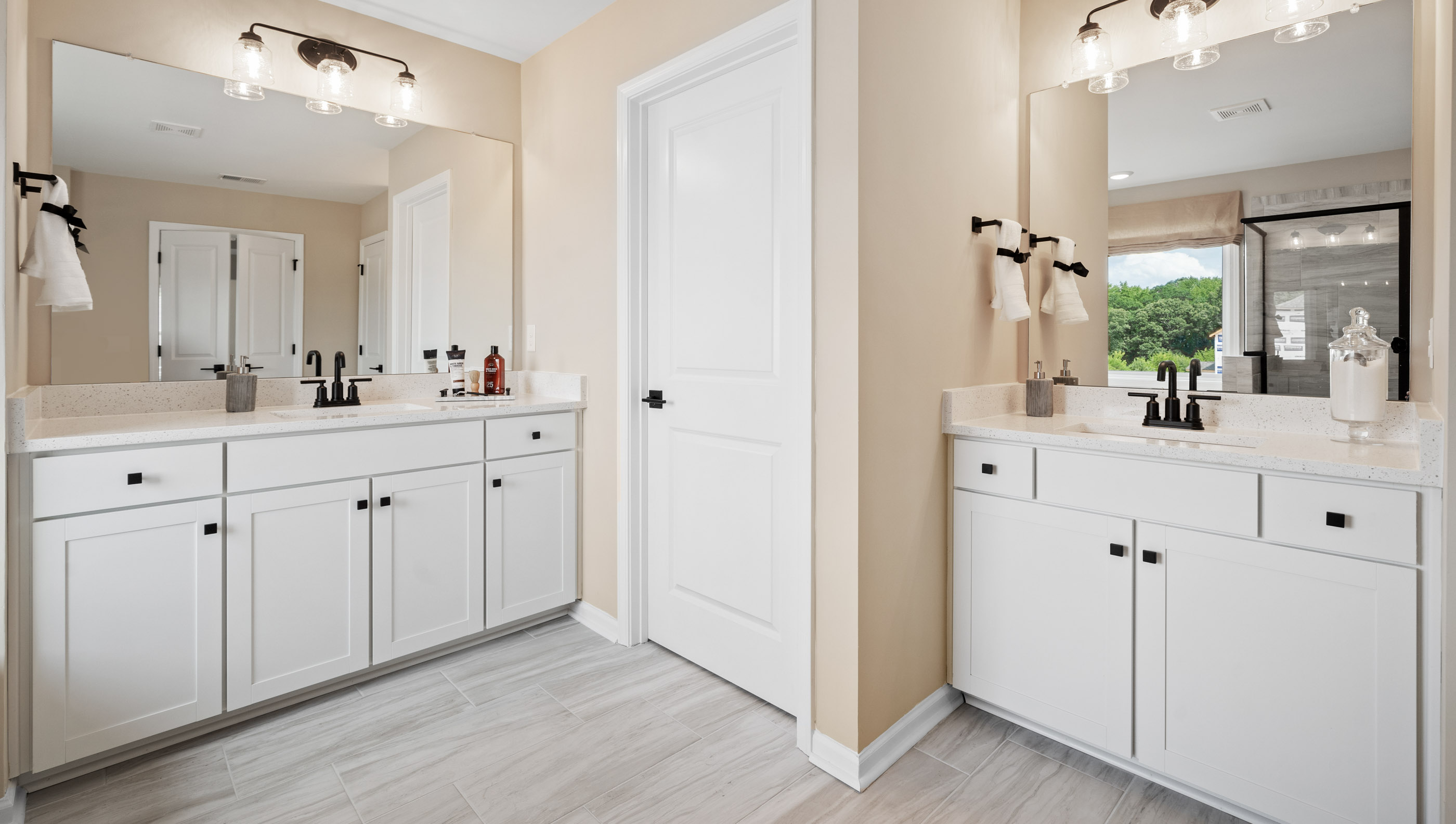 Bathroom  with tub, double vanity and walk in shower.