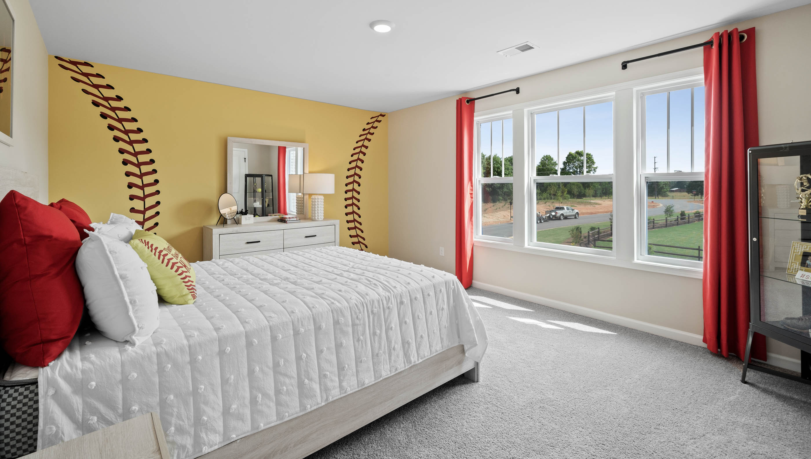 Bedroom with carpet and windows.