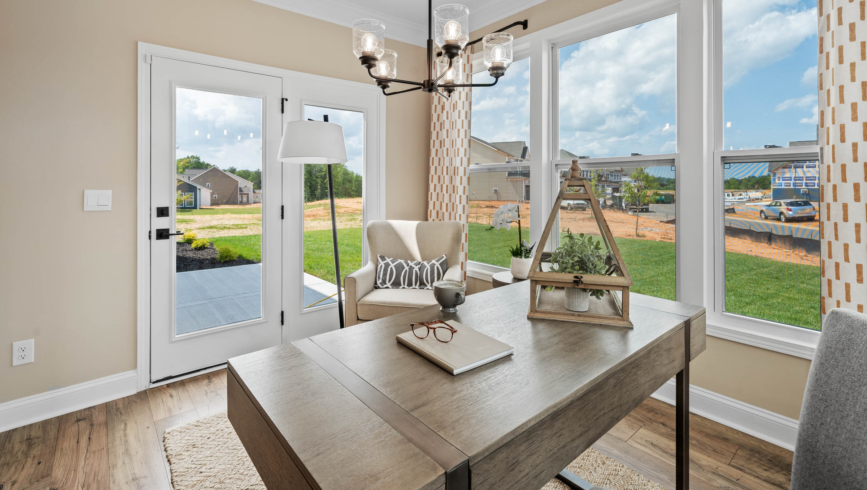 Sunroom with windows and door to patio.