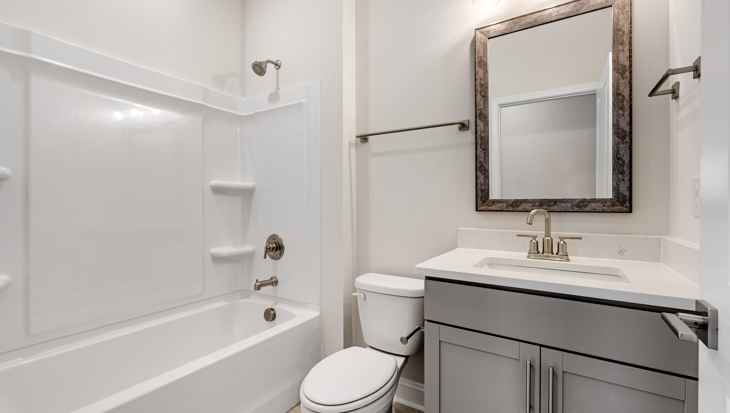 Bathroom with vanity and tub.