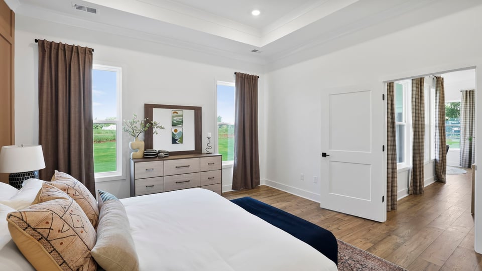 Bedroom with large windows.