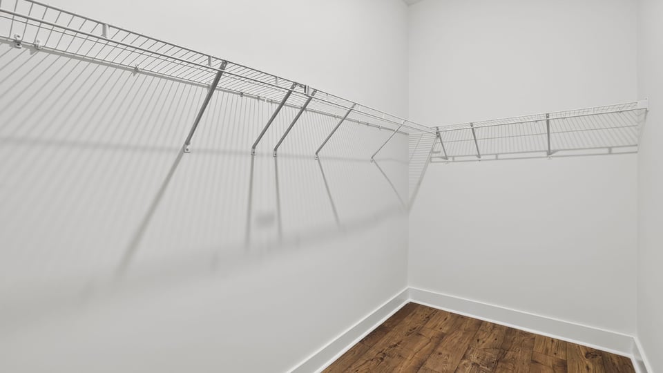 Closet with hanging storage racks.