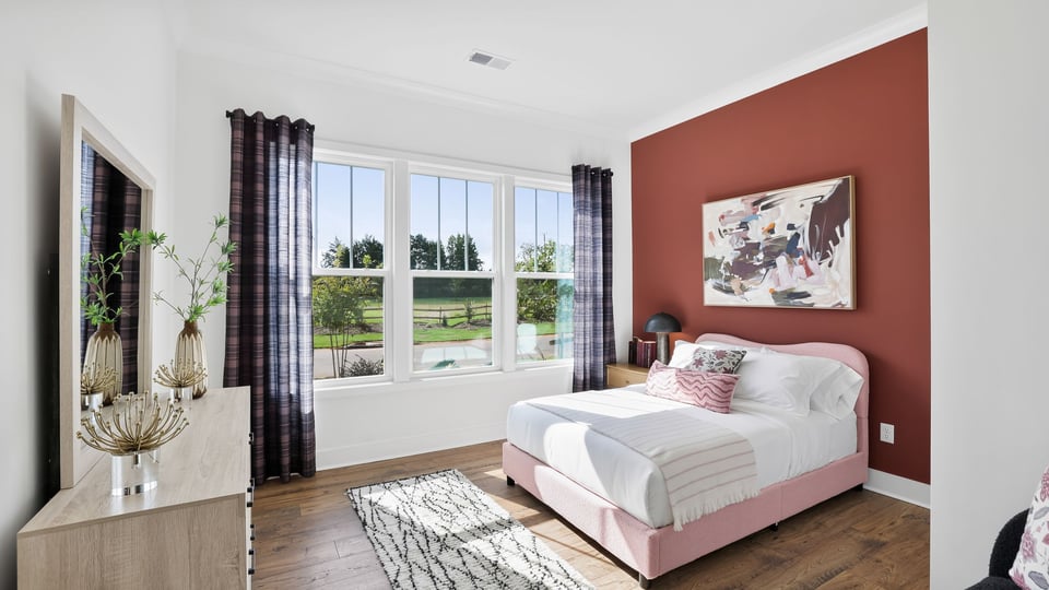 Bedroom with large window.