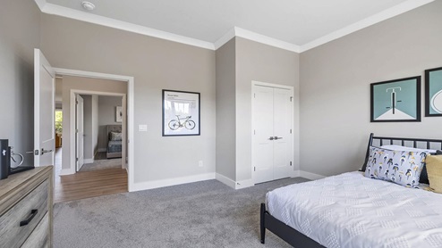 Bedroom with carpet and windows.
