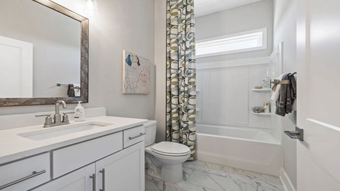 Bathroom with vanity sink and shower.