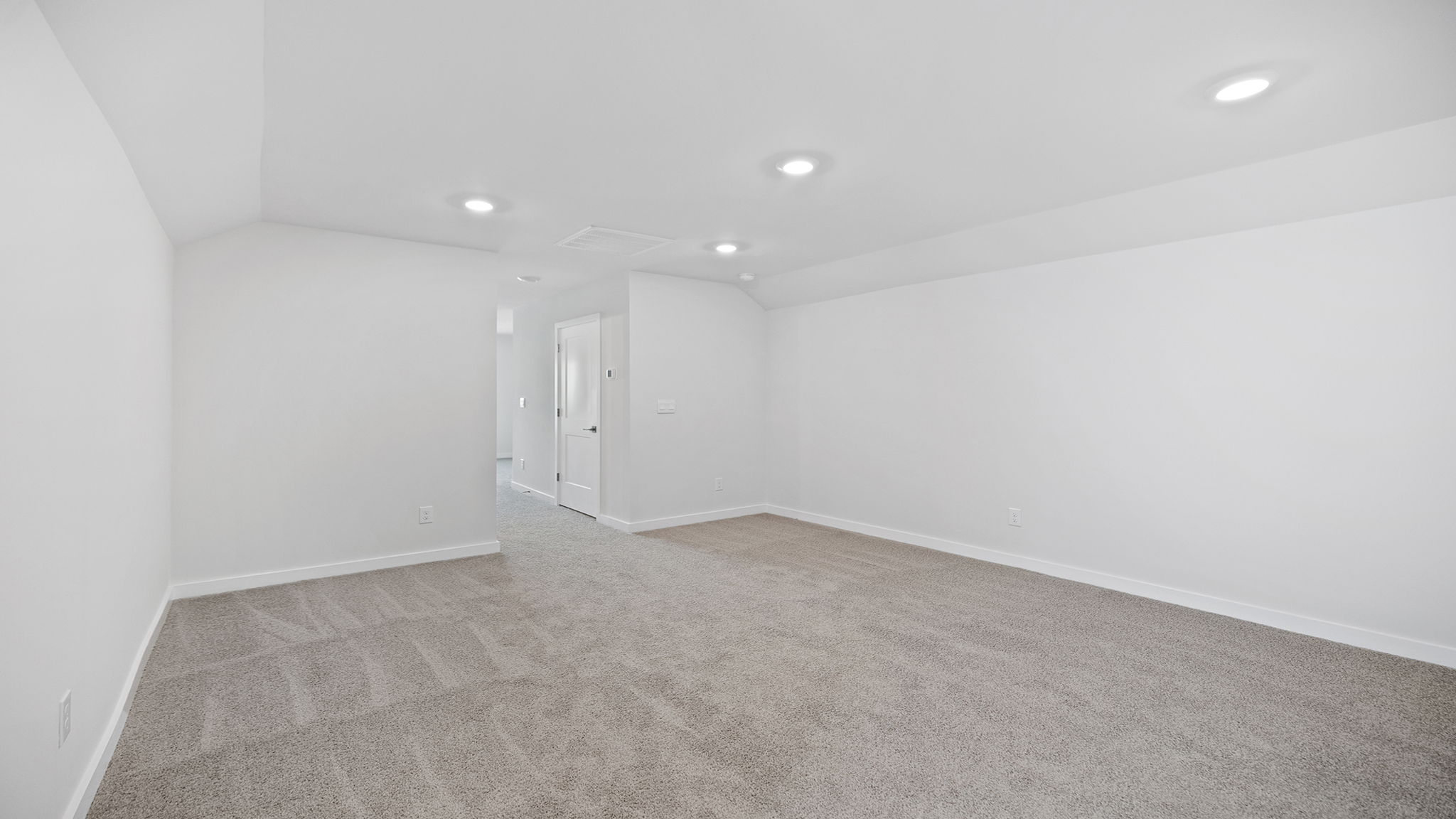 Game or bonus room with recessed lighting and carpet.