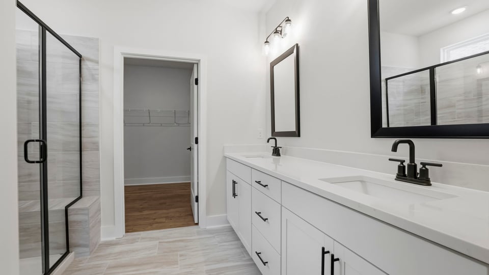 Bathroom with walk in shower and closet.