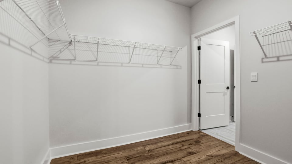 Closet with hanging storage racks.