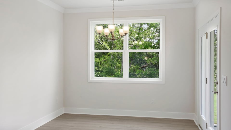 Living room with windows and fireplace.