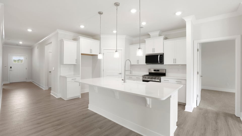 Kitchen with island and cabinets.