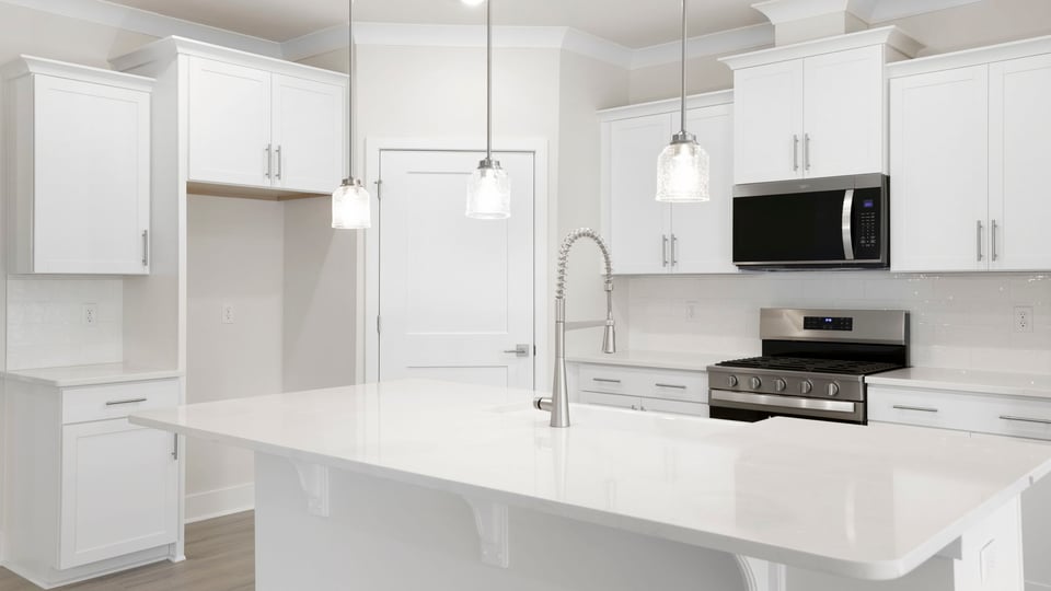 Kitchen with island and cabinets.