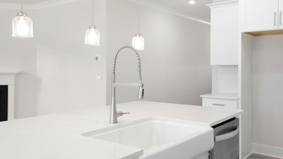 Kitchen with island and cabinets.